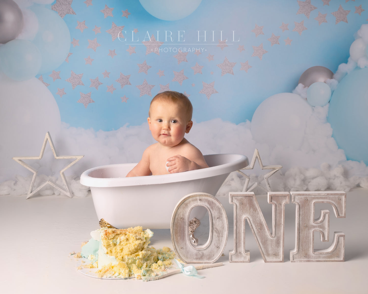 1st birthday Cake Smash & Splash photoshoot photography by professional photographer Claire Hill based in Wolverhampton West Midlands near Birmingham and Shropshire.