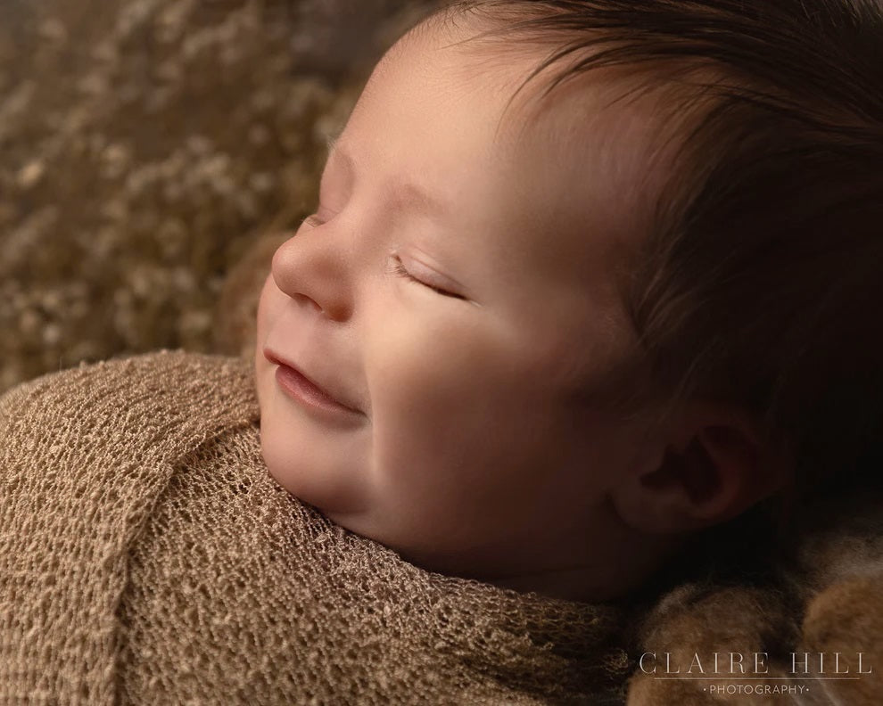 Adorable baby photos captured in Birmingham, showcasing your little one's first moments with Claire Hill Photography.