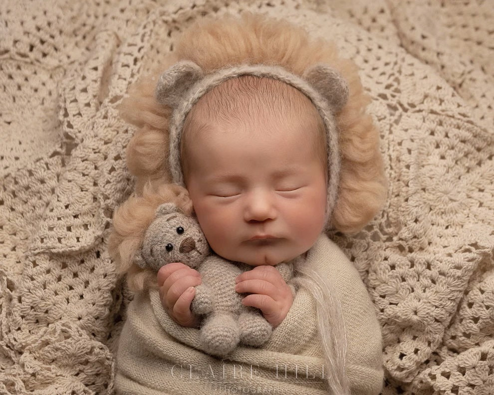 Sweet baby photoshoot in Birmingham, capturing precious moments with your little one by Claire Hill Photography.