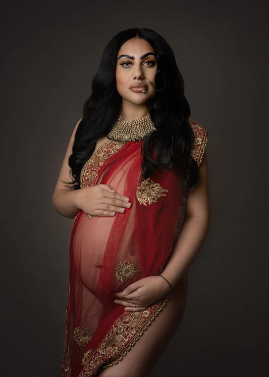 Cultural pregnancy photography session in Birmingham, featuring a mother-to-be in traditional attire, captured by Claire Hill Photography