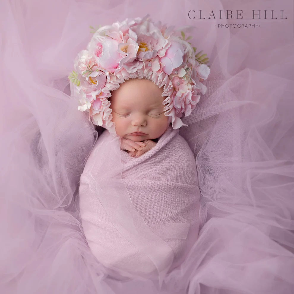 Heartwarming newborn baby photoshoot in Birmingham, capturing tender moments by Claire Hill Photography.