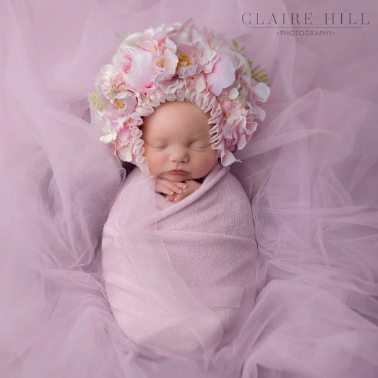 Heartwarming newborn baby photoshoot in Telford, capturing tender moments by Claire Hill Photography.